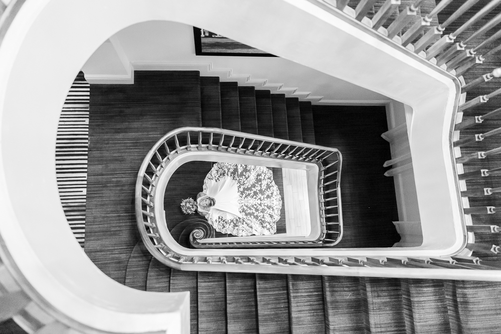 Annie Elise Photography | White House Hotel | Bridal Portrait in staircase | black and white