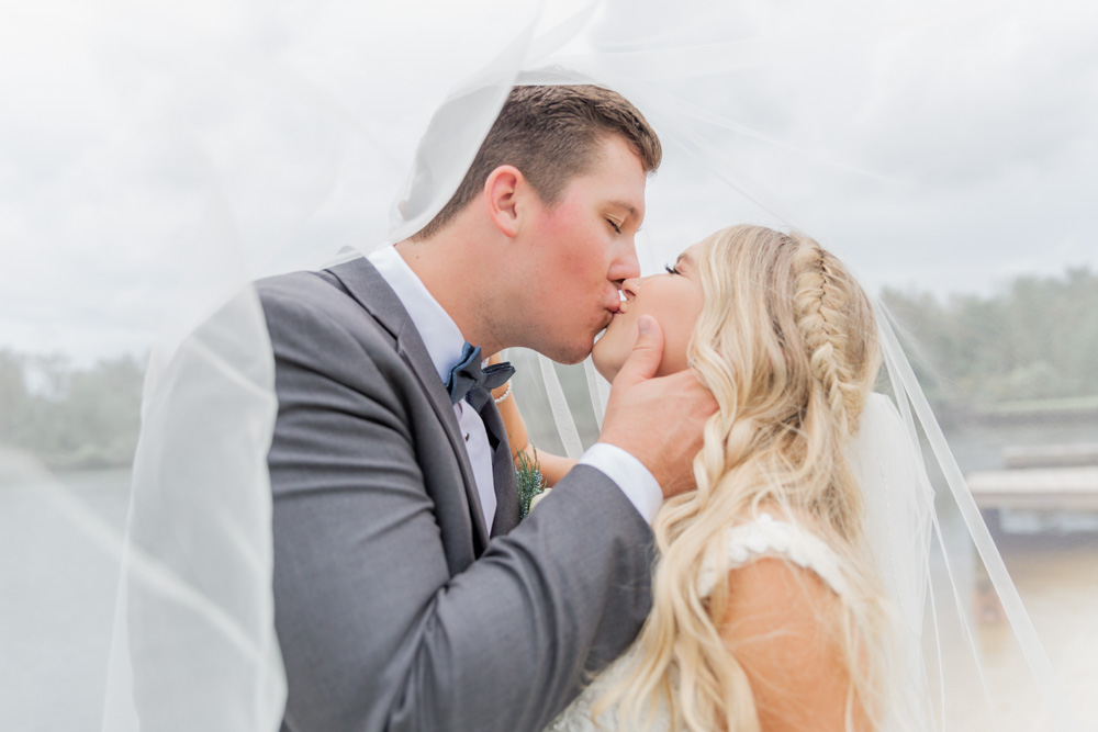 Annie Elise Photography | Under the Veil Kiss | Grey Suit Men's Warehouse | Bowtie