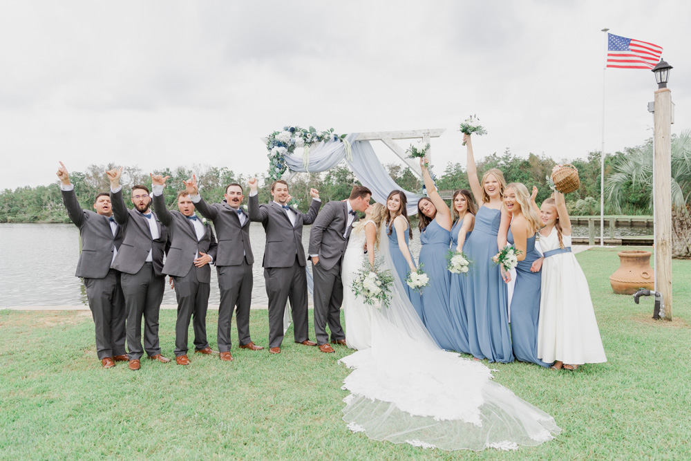 Wedding party cheering photo | couple kissing | Blue, white, grey colors